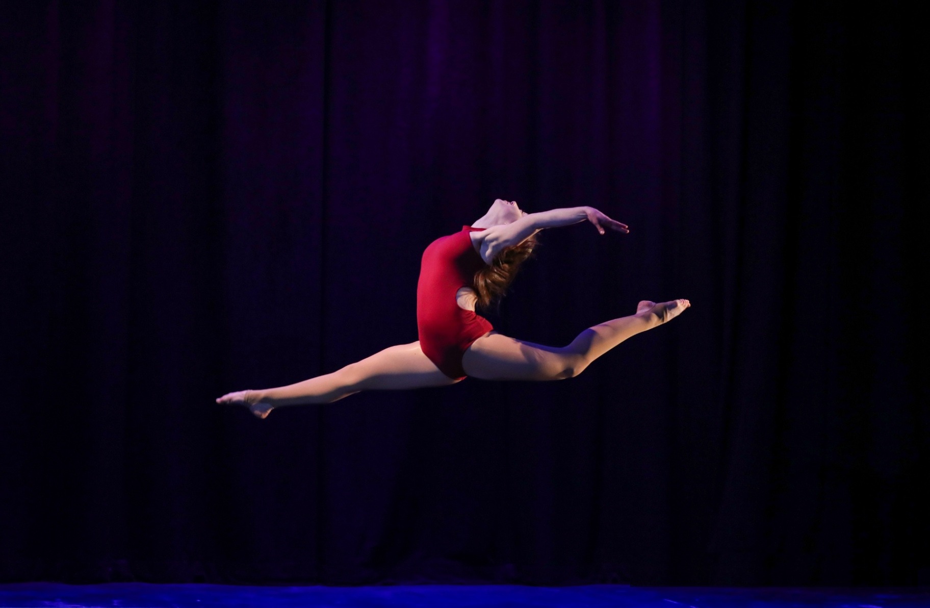 Storm King School dancer leaping on stage
