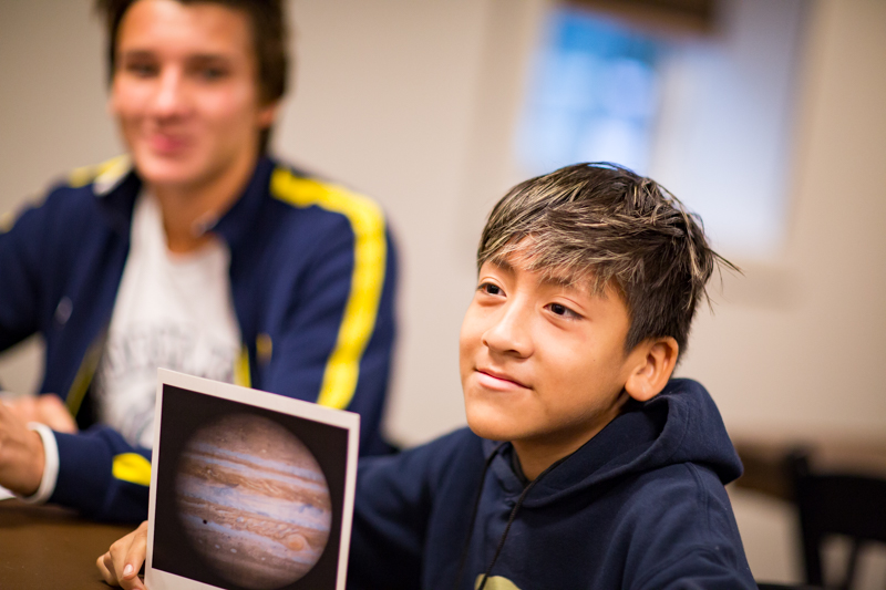 SKS Boys Varsity Soccer team member Igor Zelenko talking about Jupiter with his student