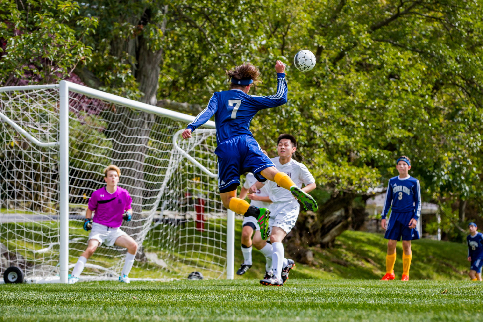 A Storm King striker rises for a header at the goal