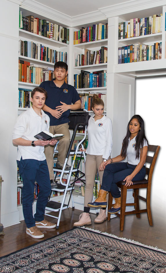 Four Storm King students together in the school library