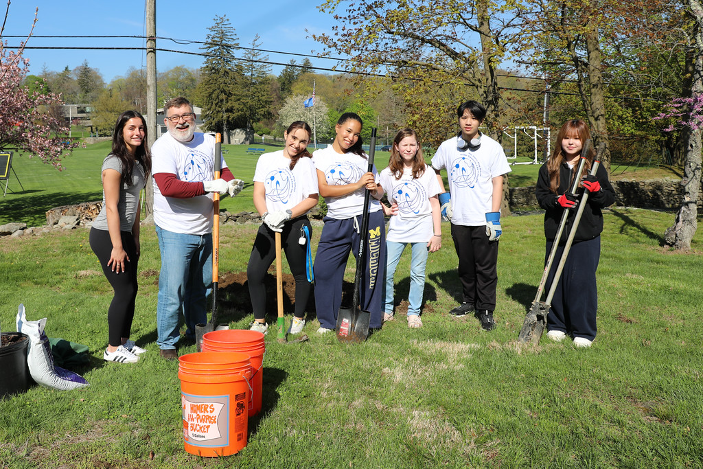 Storm King students and teacher planting trees on campus