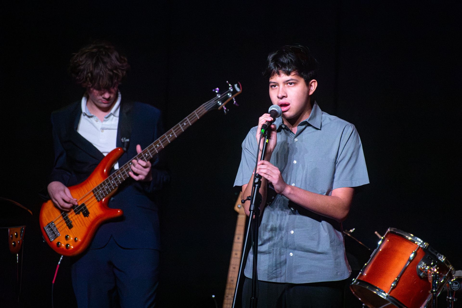 A student vocalist and bassist perform live