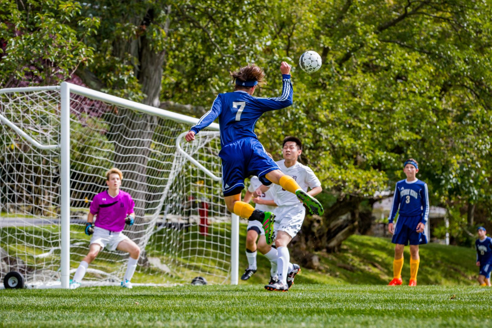 A Storm King striker rises for a header at the goal