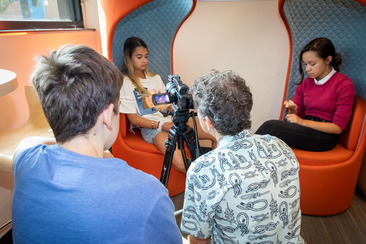 A student lines up a shot during the summer film program.