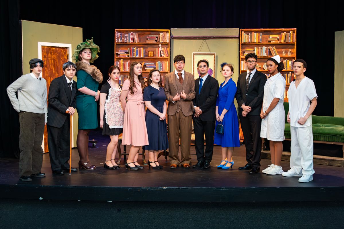 The full company on the student-built set of Harvey