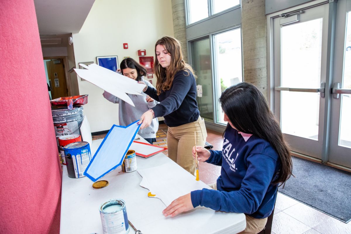 Students paint and prepare scenery flats