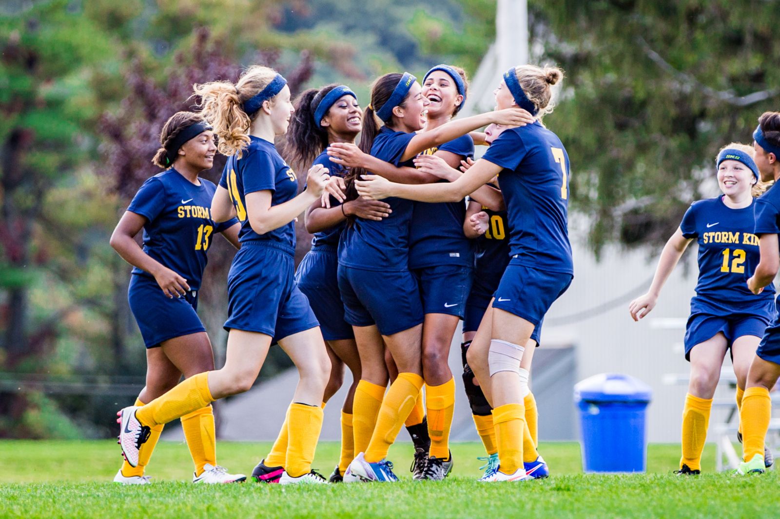 Storm King girls soccer team celebrating together