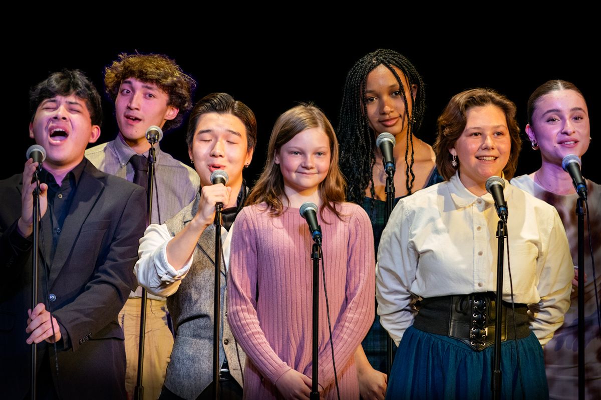 The vocal ensemble performs together