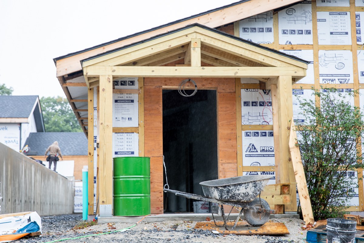 Timber-framed covered entry and open doorway at the Fischer Academic Center