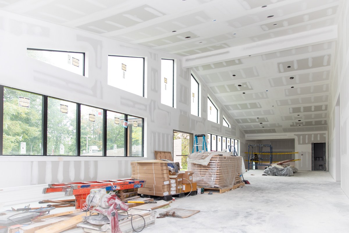Large vaulted space in the Fischer Academic Center with tall windows and clerestory glazing