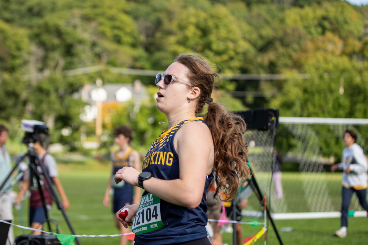 Storm King girls cross country runner finishing her race at the Storm King Invitational