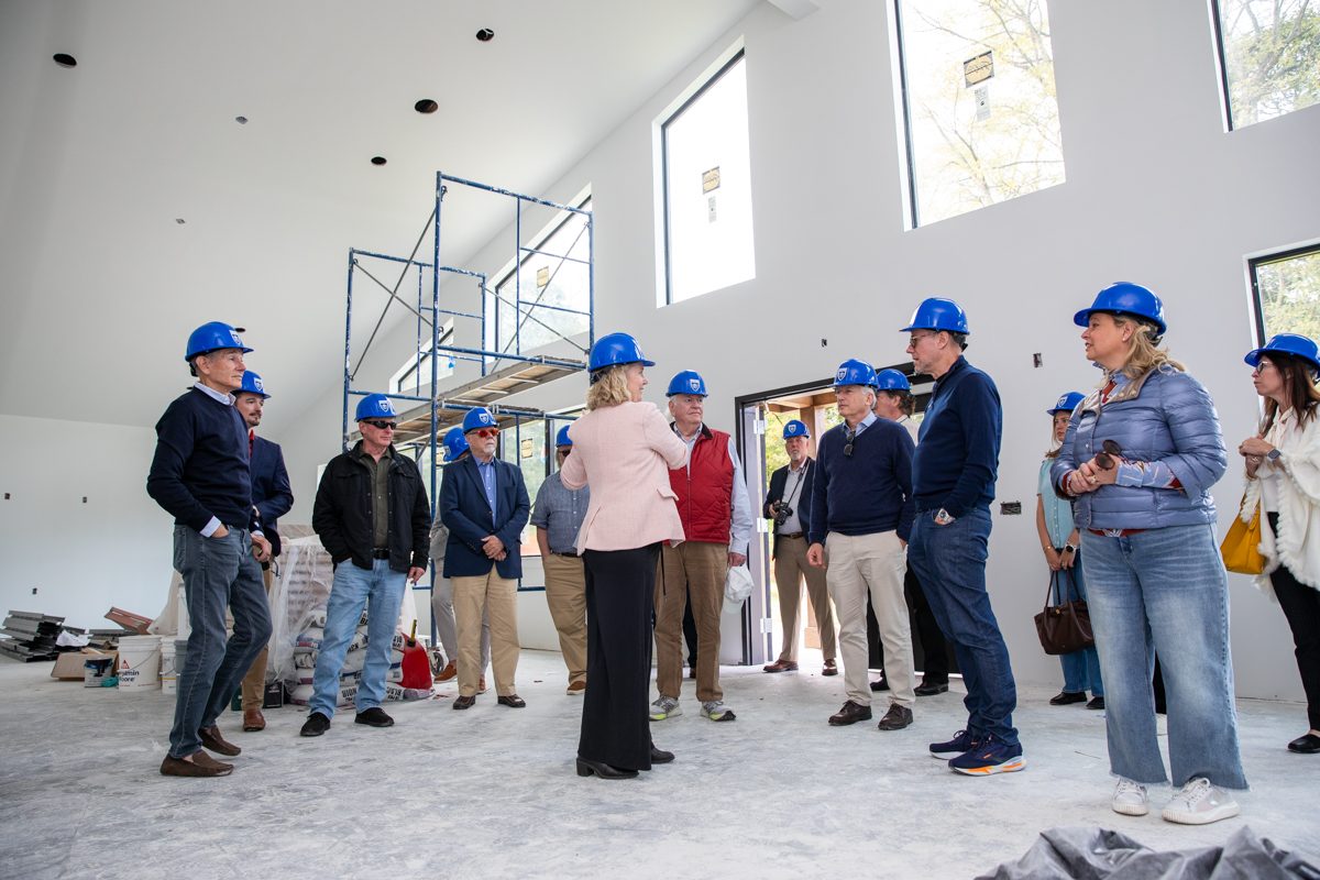 Board of Trustees members tour the interior of the Fischer Academic Center under construction