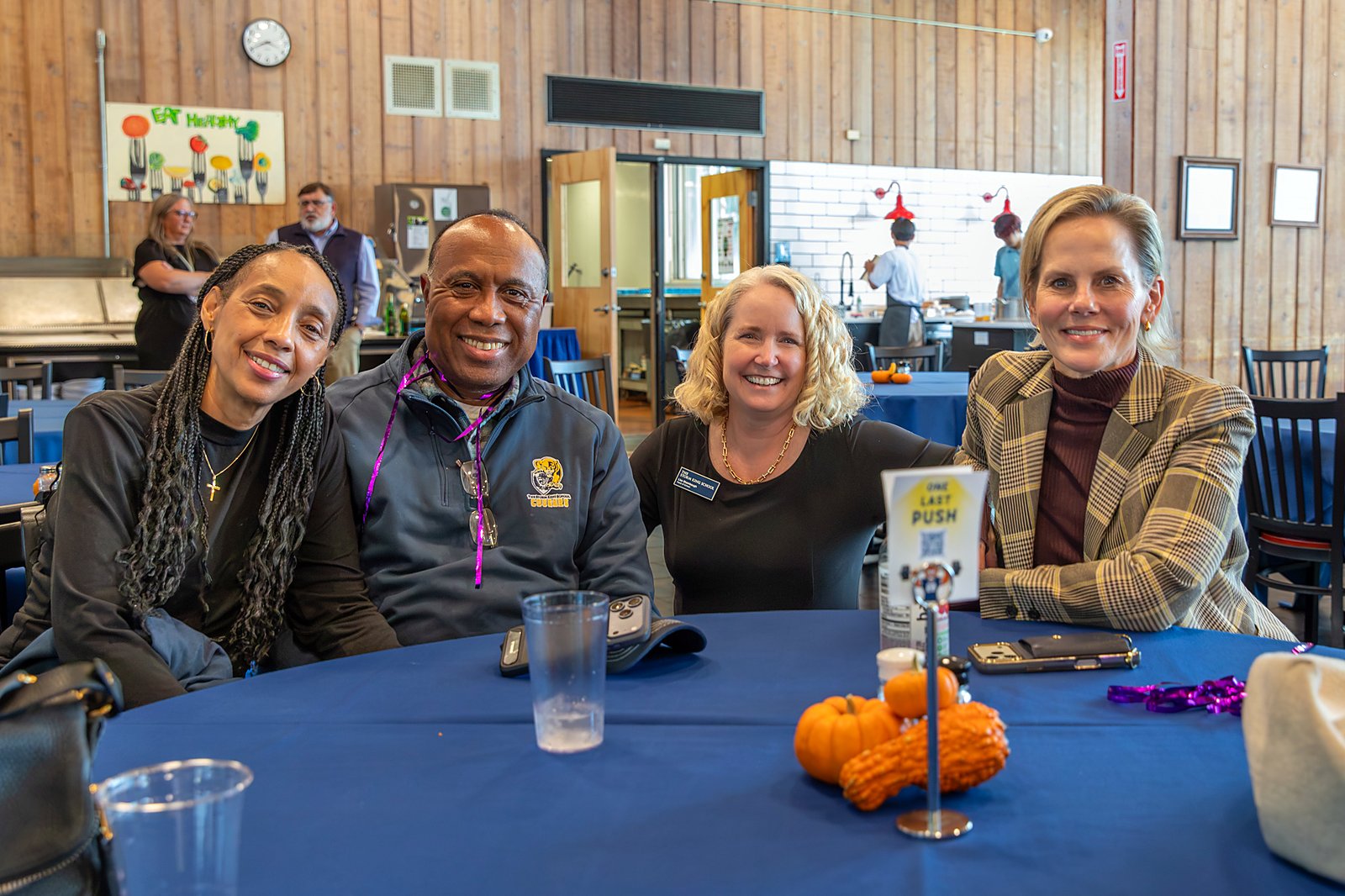 Families and School community members smile together at the Fall Family Weekend dinner